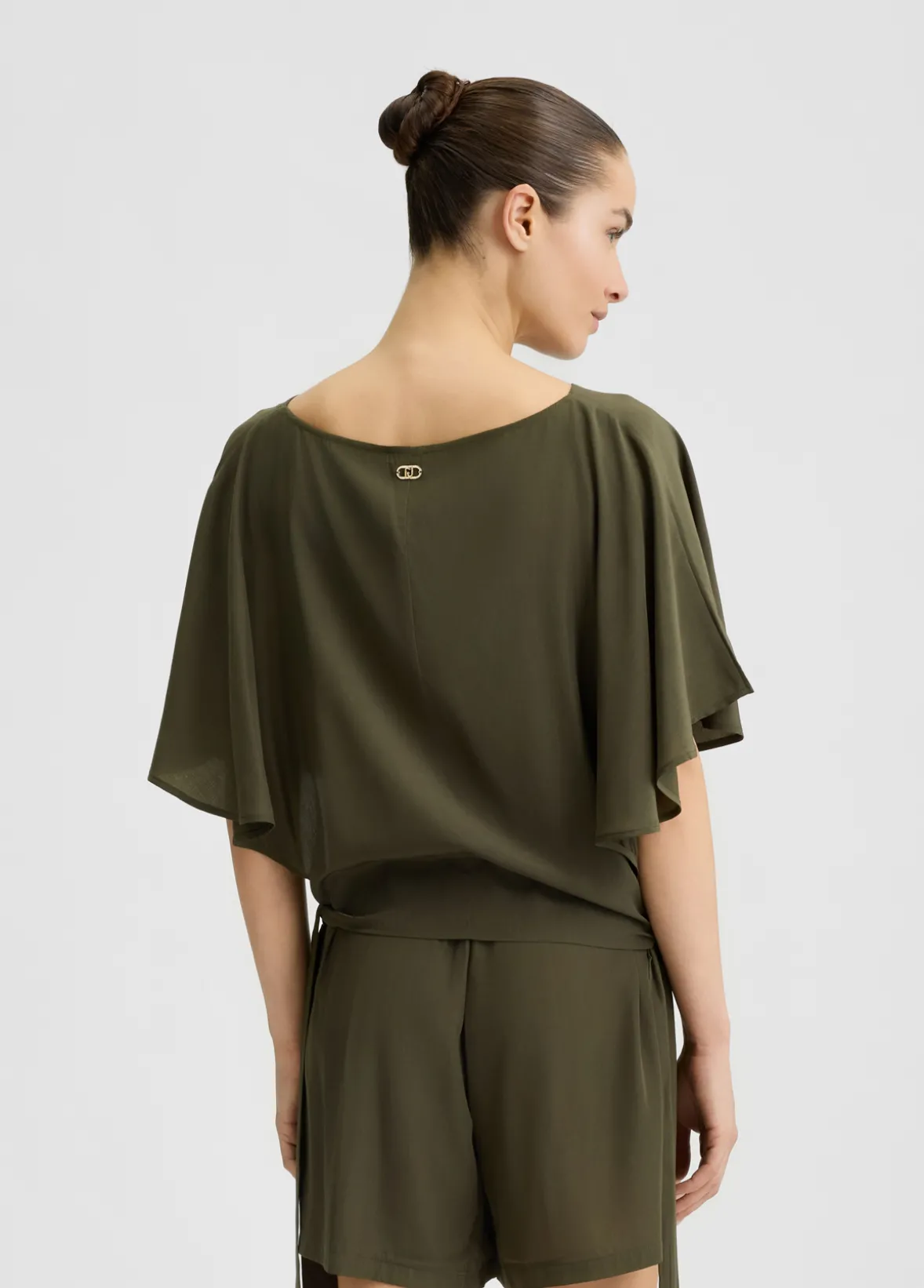 Blusa con fiocchi