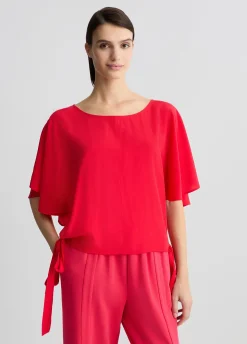 Blusa con fiocchi