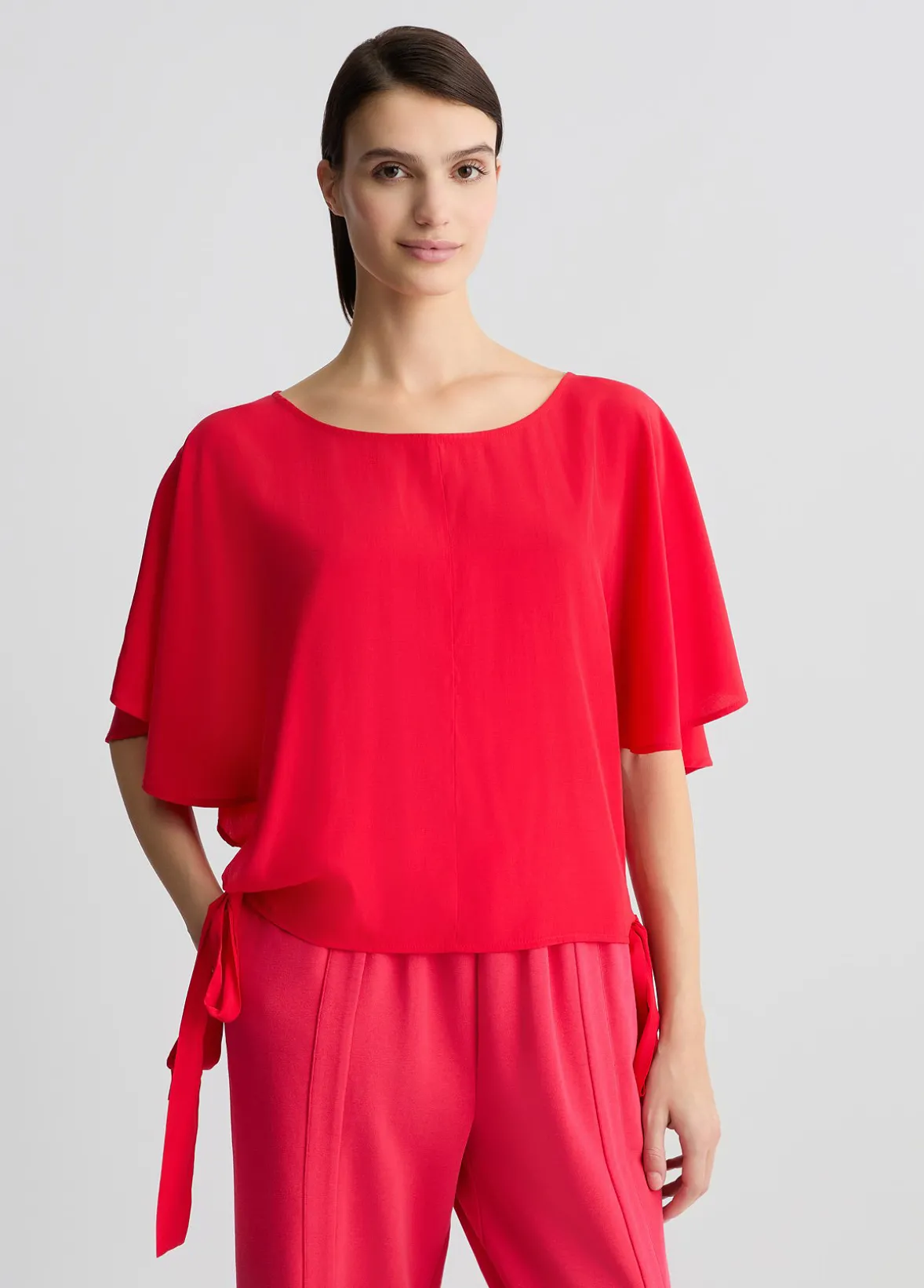Blusa con fiocchi