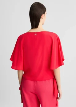 Blusa con fiocchi