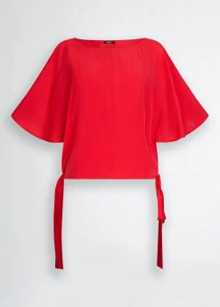 Blusa con fiocchi