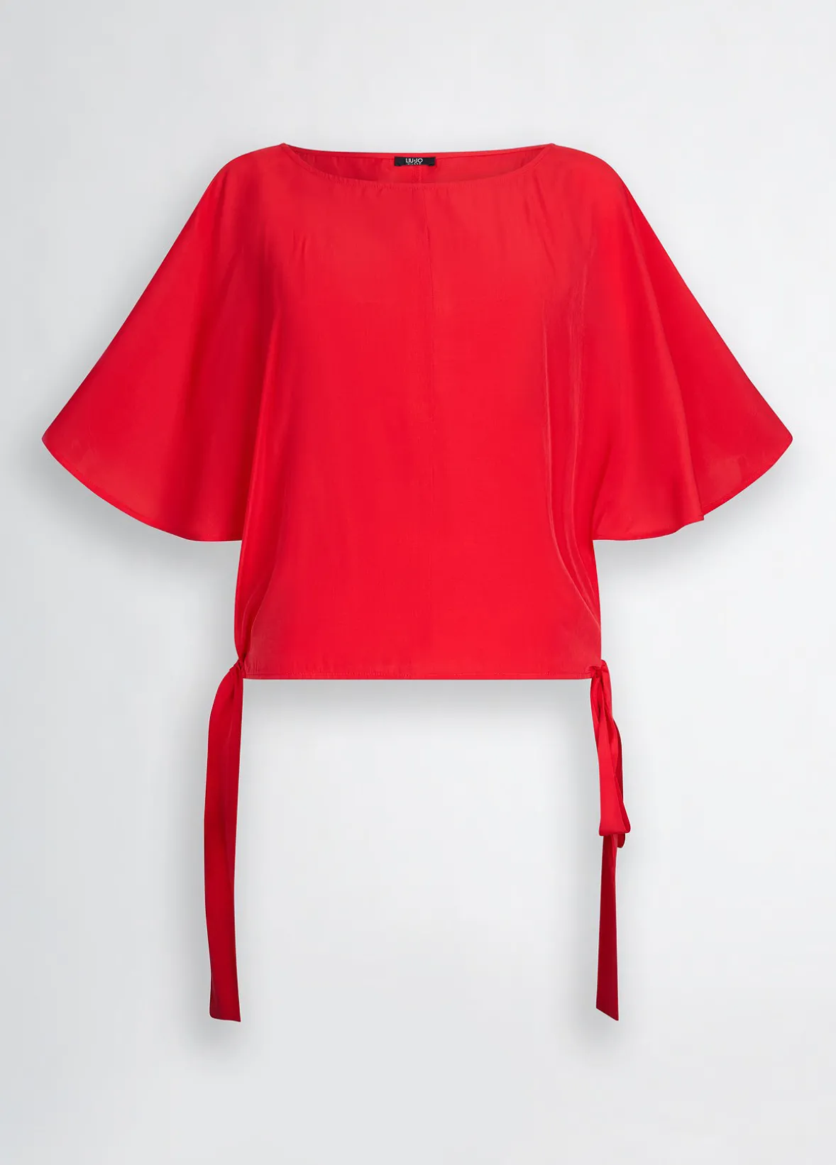 Blusa con fiocchi