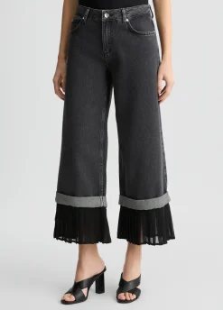 Jeans flare con orlo plissé