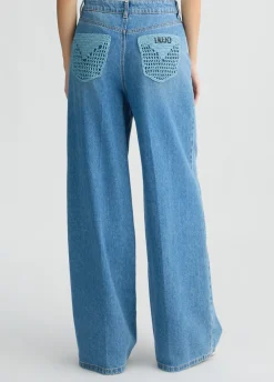 Jeans flare con tasche crochet