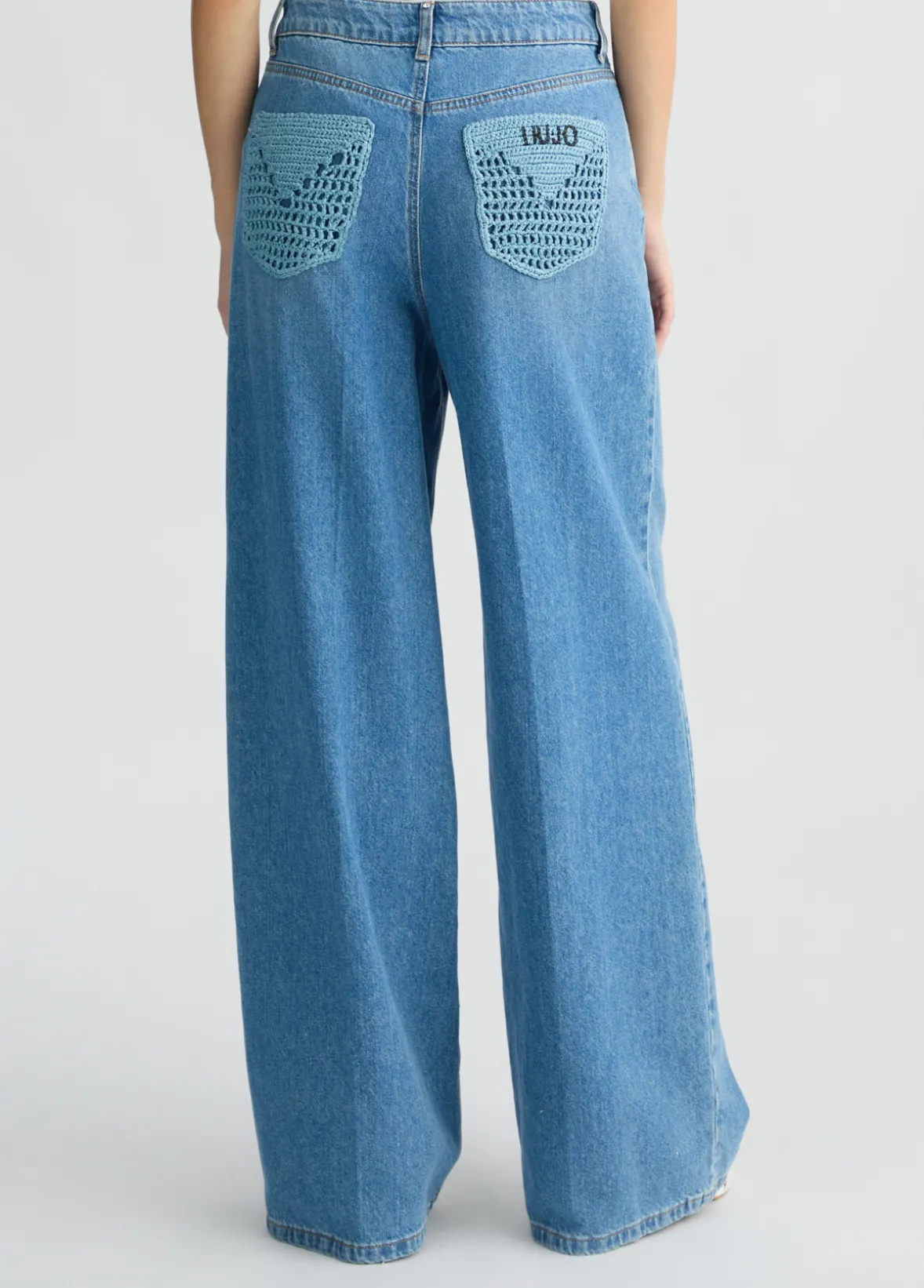 Jeans flare con tasche crochet