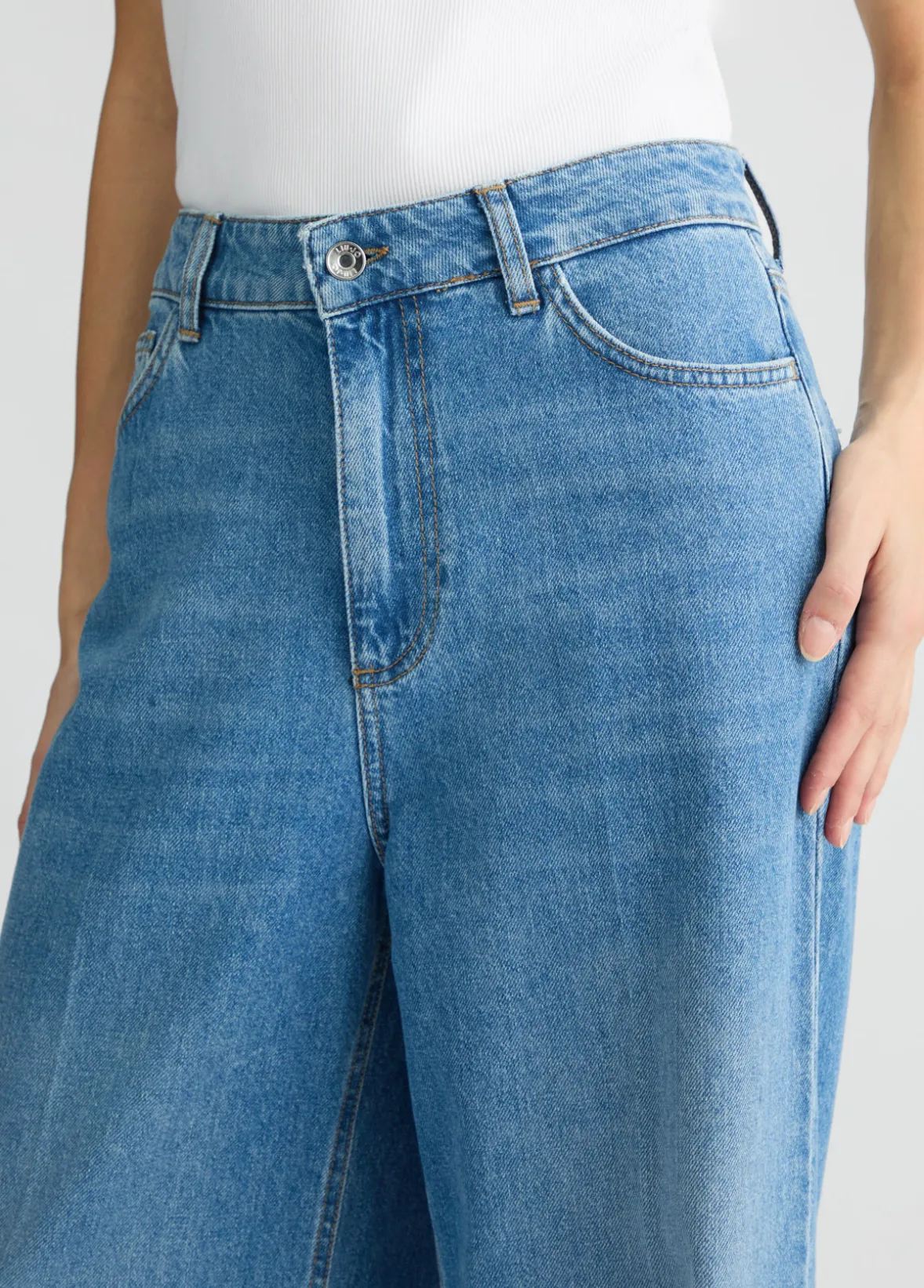 Jeans flare con tasche crochet