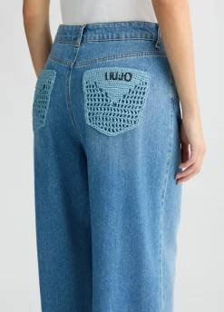 Jeans flare con tasche crochet