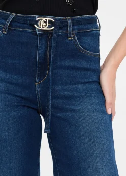 Jeans flare cropped con cintura
