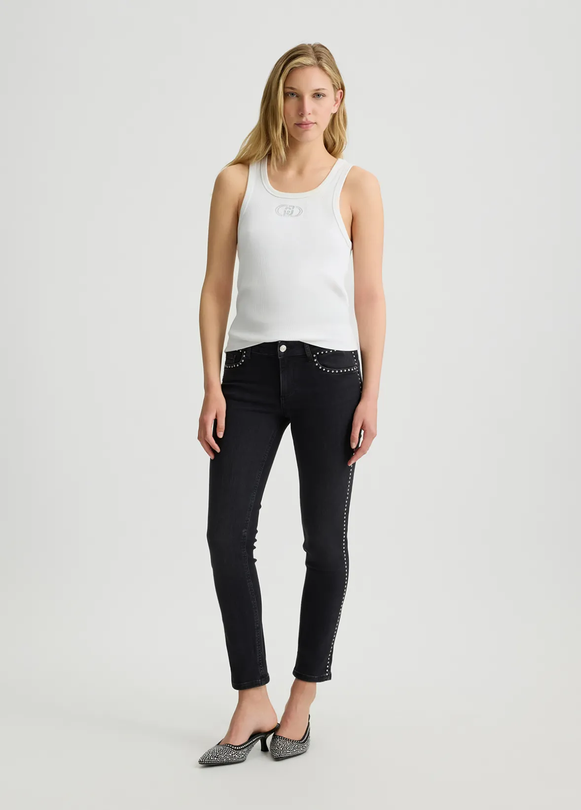 Jeans skinny con borchie