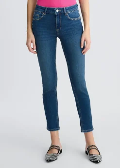 Jeans skinny con borchie