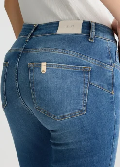 Jeans skinny con catene