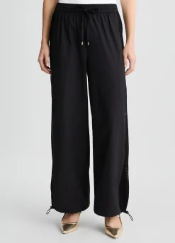 Pantaloni con inserto in rete