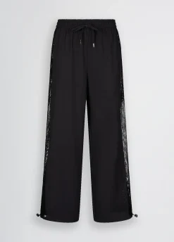 Pantaloni con inserto in rete
