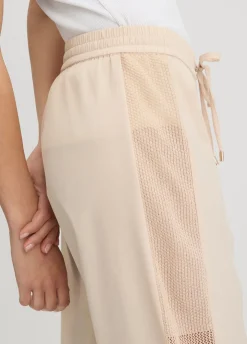 Pantaloni con inserto in rete
