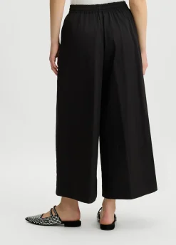 Pantaloni cropped a palazzo