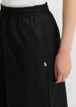 Pantaloni cropped a palazzo
