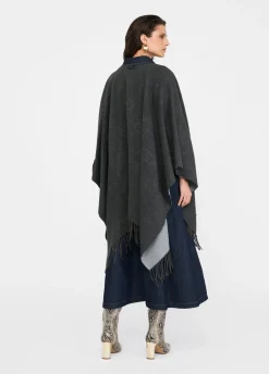 Poncho con logo e frange