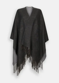 Poncho con logo e frange
