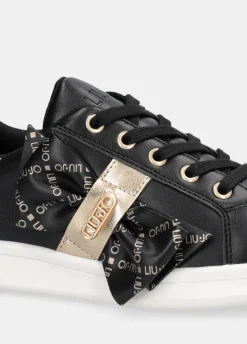 Sneakers con maxi fiocco