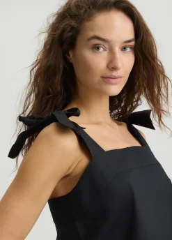 Top in cotone con fiocchetti