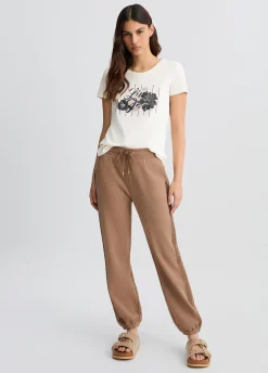T-shirt con logo floreale e strass