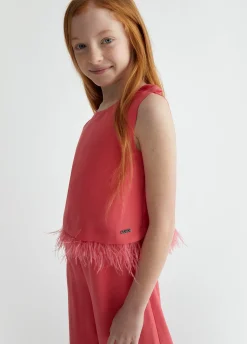 Tuta elegante con piume