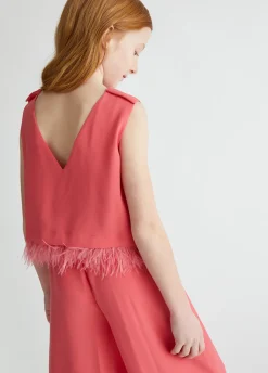 Tuta elegante con piume