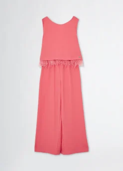 Tuta elegante con piume